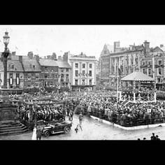 Northampton Market Place, showing Isaac's Fountain during a visit by the King