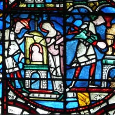 Lincoln Cathedral - Legend of the Jew of Bourge (13th c.) - The Jew of Bourges throws his son into a glass furnace in rage after the son had gone to Communion, but the boy is saved by the Virgin Mary.