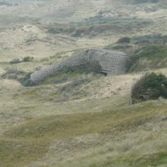 One of a Large Number of Bunkers at the High Point of the Jew's Road.  Pockets in the Concrete were created to allow grass to grow over the bunker, by using screwed-up paper when the concrete was wet.