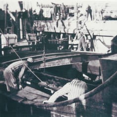 SS prisoners from Camp Sylt, who included many Jews, working at the Harbour in their striped camp uniform (Ph. Alderney Museum)