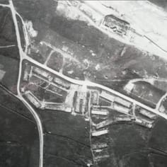 Helgoland Camp from the air showing hut bases and internal roads, after it had been dismantled.  The beach depot can be seen to the north. (PRO 1949)