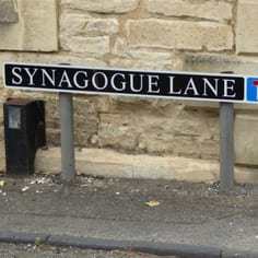 The newly restored sign of Synagogue Lane - the only street in England with this name. The original sign had dispeared but was recently restored by the Council on the request of the synagogue in Cheltenham.  Orignally, there was also a Synagogue Street in Norwich, now demolished.