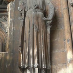 'Church and Synagogue' - The Judgment Porch (map, no. 13) - Judgement Porch - The figure of 'Synagogue' (above) supported on a medieval Jew (below) bearing the 13th Century Jewish Badge.