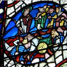 Moses with Horns - Stained Glass Windows, East Window South Aisle and Theophilus Window (map, no. 8) - Moses with horns in a scene depicting the Egyptians drowning in the Red Sea and showing another Jew wearing the contemporary Jew's Hat (Theophilus window upper panel).