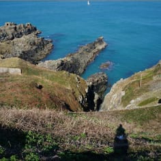 Fort Albert: this site, off a former concrete bridge spanning the chasm and very close to the former observation tower,is thought to be where prisoners were pushed over the edge of the cliffs according to Dalmau.  Also the site with the two pill boxes at Roselle Head (upper left) are also stated to be a disposal site.  Piles of bones under the sea and against the cliff were seen after the War.
