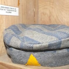 Cap from Lager Sylt concentration camp prisoner uniform at Guernsey Museum.