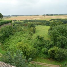 The Glacis and the spoil heap from the construction of the German tunnels, at Montreuil. The spoil heap is in the center of the picture.