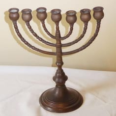 A c. 19th Century Menorah used in possession of the Panacea Society in Bedford in the 1920s.  The society, a Christian Messianic cult, may well have obtained it locally.