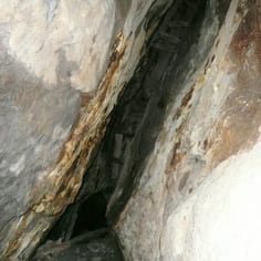 A 'strope' within St George's Shaft, where the vein has been followed and excavated out to around a height of 30-40 feet. This is just before the