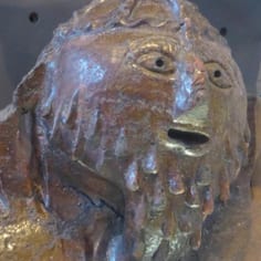 A medieval Lincoln anti-Semitic caricature roof tile representing a medieval Jew, or the Jewish High Priest, in the Collection.