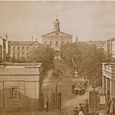 An image showing the international headquarters of the London Society for Promoting Christianity Amongst the Jews, at Bethnal Green, in the East End of London. The image shows the respectability and order, within the gates of the institute, the 'Operatives Chapel' (Messianic-Jewish converts' chapel), children who were being educated in the mission school, and the group of probably Jewish figures at the front right-hand side are being challenged by a missionary to convert to Christianity.