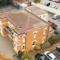 The Lodge next to Woking Mosque, which functioned as a museum and gallery, as it housed part of Leitner's Gandharan art collection and was the first permanent display not only of Gandharan art, but one almost entirely specialising in Gandharan art, in the UK and where the art could be studied and appreciated on its own terms (image 'Heritage Drones')